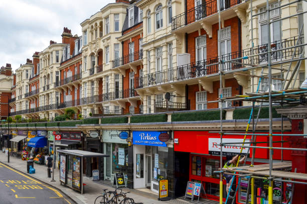 London, Great Britain - August 3, 2015: View along a London street with many small shops.