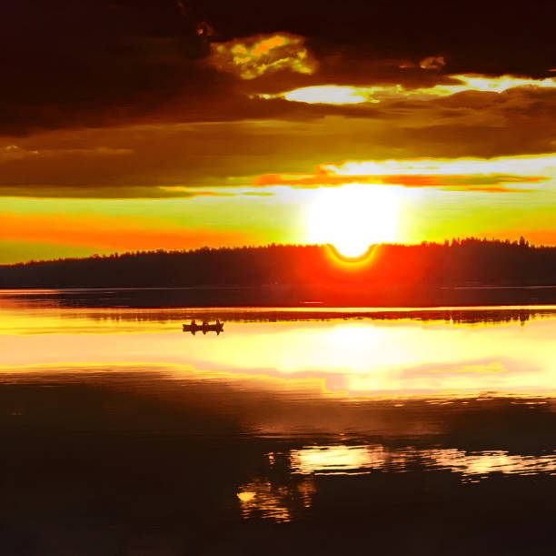 Flamimg yellow sunset with small boat over dead calm sea