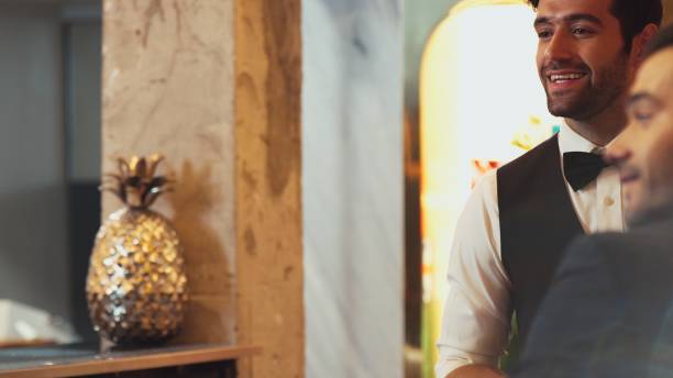 istock Smart bartender talking customer at beverage bar beside view scene. Vinosity. 2170524474