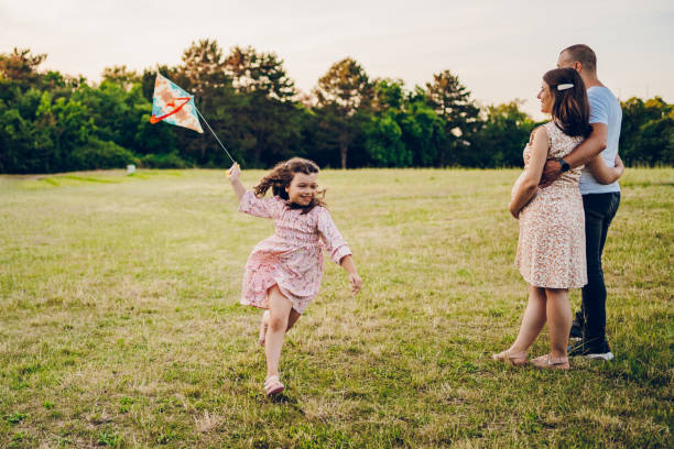 istock Parents playing with their daughter in nature park 2170526888