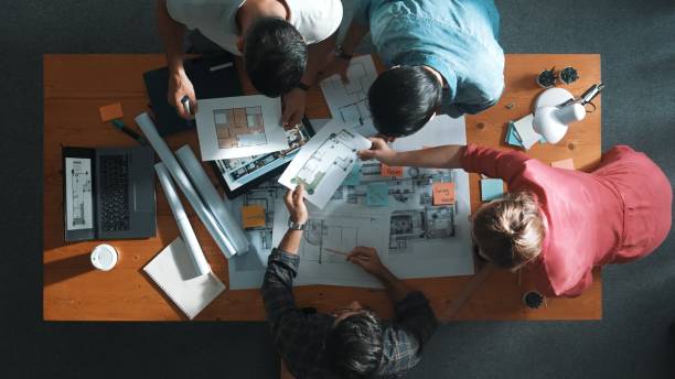 istock Top view of skilled civil engineer talking while standing at meeting. Symposium. 2170530991