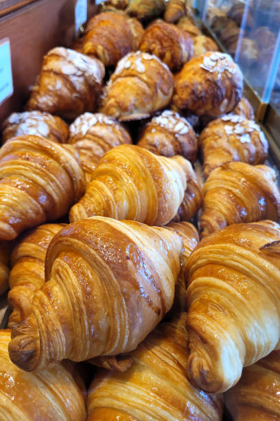 istock Freshly baked croissants in bakery store close up 2170531418