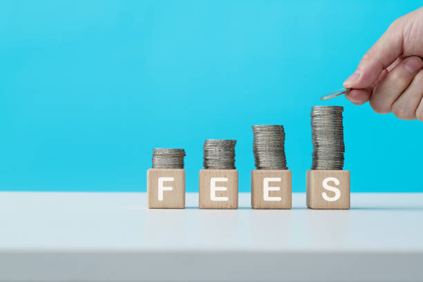 istock Stack of coins on word fees 2170532794