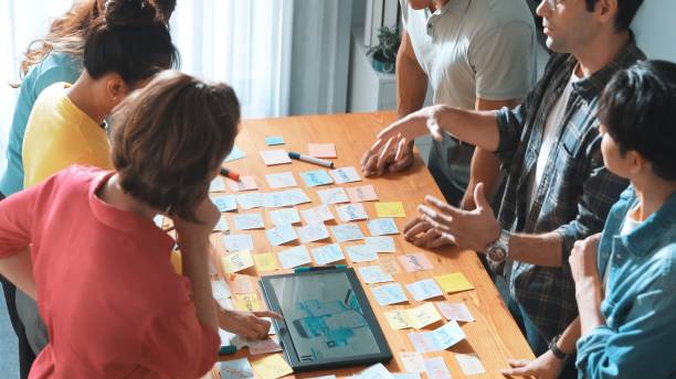istock Top view of manager writing idea on sticky notes and explain idea. Symposium. 2170533538