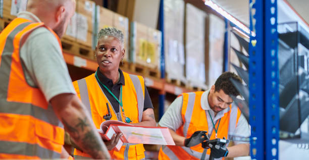 istock senior warehouse manager giving safety induction 2170536789