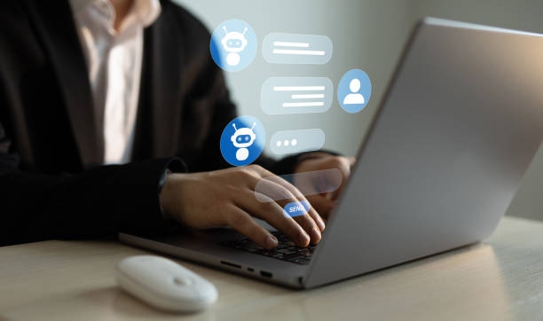 istock Businessman talking to a robot assistant.Contact us for online support. Customer service, helpdesk advice online chat support. 2170539554