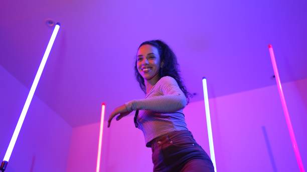 istock Low angle camera of hispanic dancer looking at camera and dancing. Regalement. 2170540703