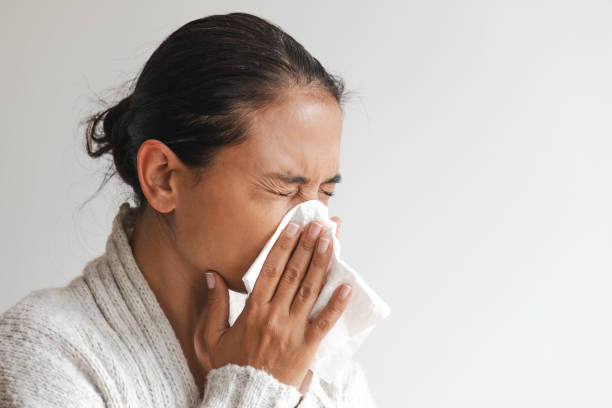 istock Woman Blowing Her Nose 2170541004