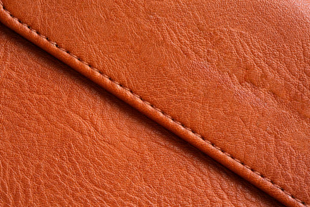 istock Brown macro leather texture,Synthetic leather brown background texture. Brown leather textured background. 2170544111