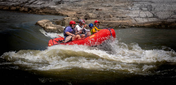 A family of four makes its way down rapids on the Illinois River near Watts, Oklahoma, June 1, 2024.