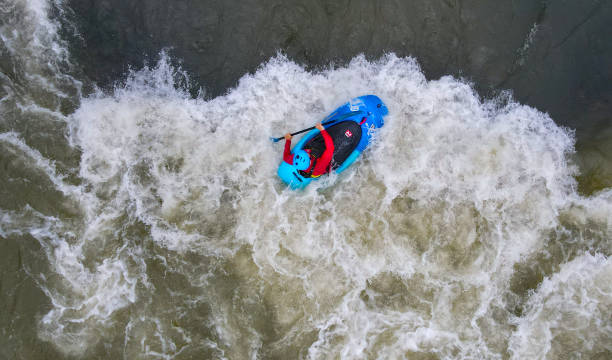 Skilled whitewater kayaker in a \