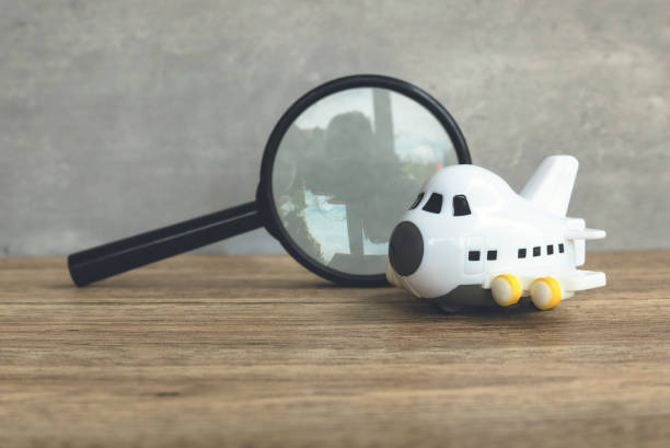 Toy Airplane and Magnifying Glass Together, Symbolizing Exploration and Imagination