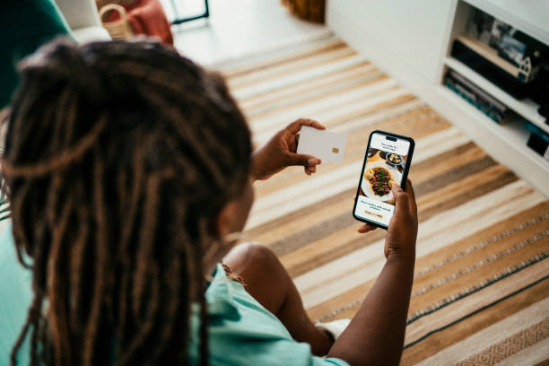 istock Black woman ordering food through app 2170546761