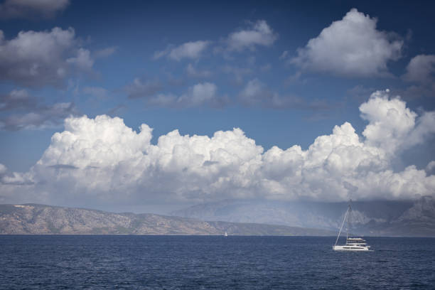 The boat is sailing on Adriatic Sea in cloudy weather.Hvar Island - Croatia.
