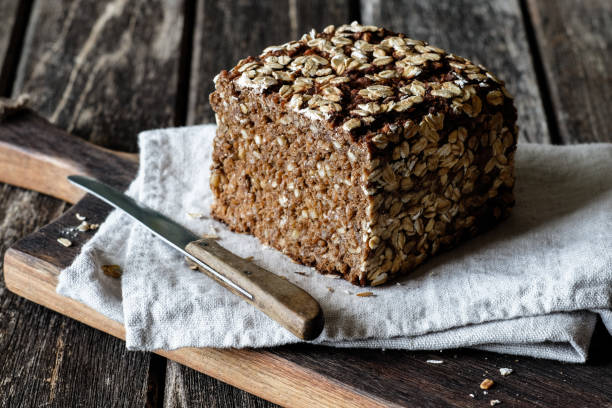 istock Wholemeal rye bread on a wooden board 2170548523