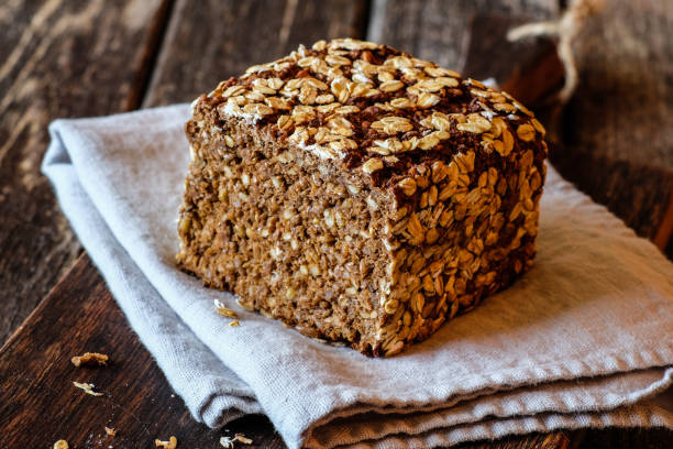istock Wholemeal rye bread on a wooden board 2170548525