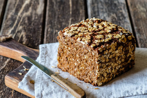 istock Wholemeal rye bread on a wooden board 2170548530