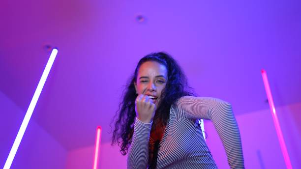 istock Low angle camera of hispanic dancer looking at camera and dancing. Regalement. 2170550065