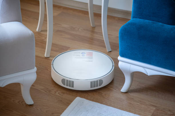 istock Robot vacuum cleaner working in living room 2170550740