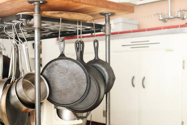 istock Hanging pot rack with pans and pots in kitchen. 2170550807