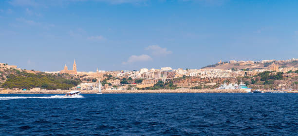 Seaside view of Mgarr bay, panoramic photo taken on a sunny summer day