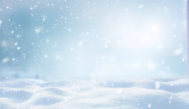 Beautiful background image with snowdrifts and snowfall for work on a winter theme.