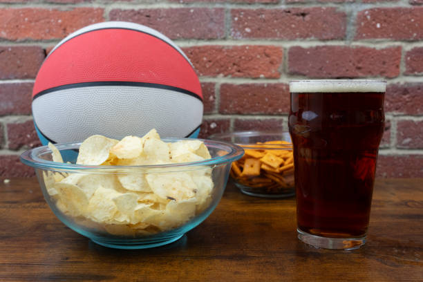 istock Beer and snacks on a table with basketball 2170557580