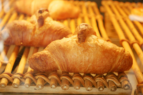 fresh baked croissant in a bakery .