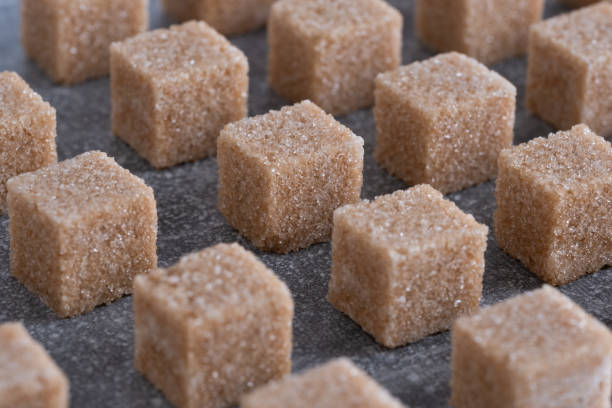 Straight rows of cane sugar cubes. Effect of dynamics.