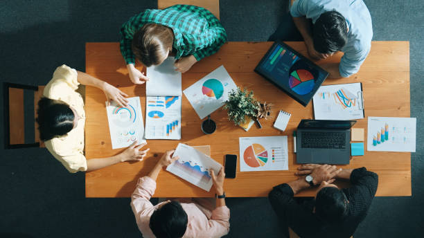istock Top view of manager use tablet to analyze data and financial chart. Convocation. 2170565074