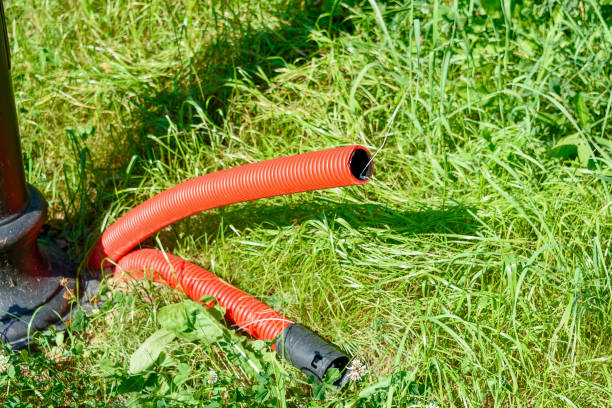 istock Red plastic pipes for wiring electrical wires underground. 2170566460