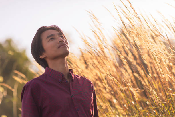 istock Man enjoying a sunny day outdoors in nature 2170566576