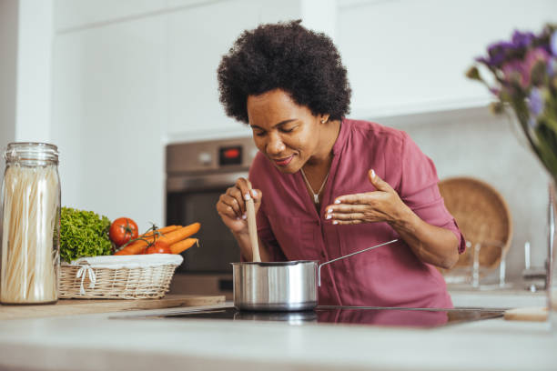 istock Woman Enjoying Cooking in a Modern Home Kitchen 2170566980
