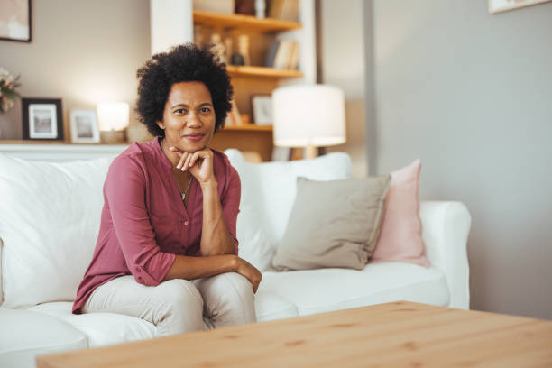 istock Relaxed Woman Sitting on Comfortable Sofa at Home 2170567027