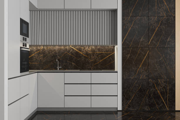 istock Modern Small L shape Kitchen with white cabinets and large black marble tiles. 2170567211