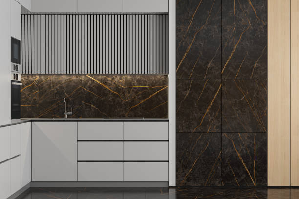 istock Modern Small L shape Kitchen with white cabinets and large black marble tiles. 2170567264