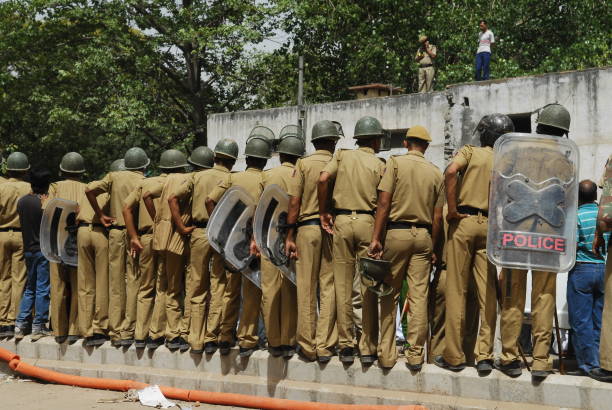 New Delhi, India - April 21 2010 :Police personnel standing in line on the road divider, ensuring safety and order.