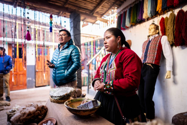 istock Chinchero indigenous woman explaining about textile industry, in Chinchero District, Peru 2170570993