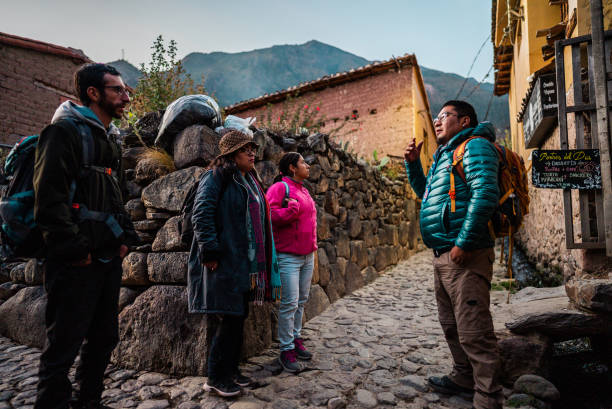 istock Tour guide talking with tourists on a Chinchero district, Peru 2170572280