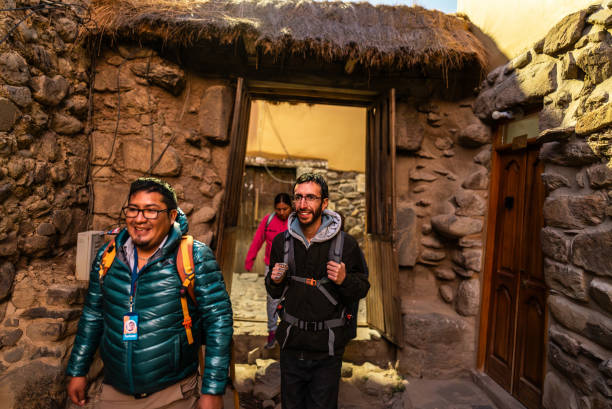istock Tour guide and tourists walking on a Chinchero district, Peru 2170572300