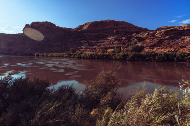 The famous offroad Shafer trail in the canyon near Moab, reaching Canyonland National park, Utah. View on the Colorado river