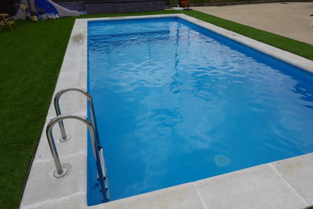 istock Backyard Swimming Pool with Stainless Steel Ladder 2170578603