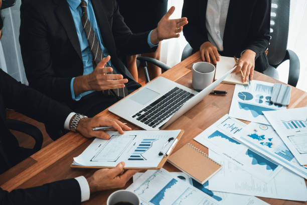 istock Group of business analyst team analyzing financial data report. Habiliment 2170579130