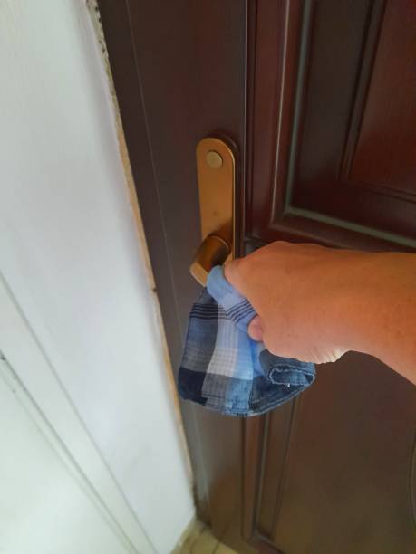 istock Bronze color doorknob with hand 2170581469