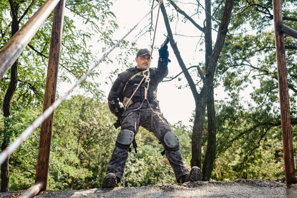 istock Special forces operative skilfully descending rope  in military training 2170585372