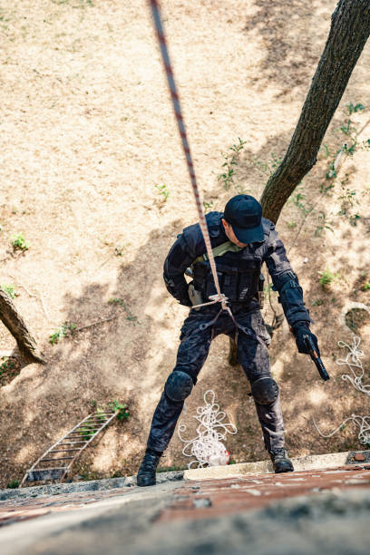 istock Special forces operative skilfully descending rope  in military training 2170585377