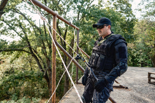 istock Special forces operative getting ready for descending rope in military training 2170585445