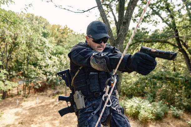 istock Special forces operative skilfully descending rope in military training 2170585452