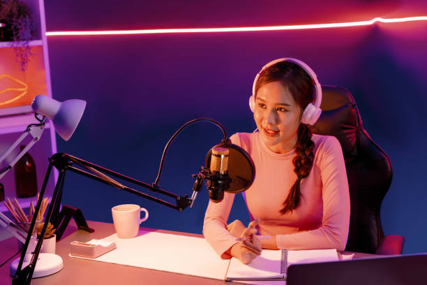 istock Smiling creative young beautiful Asian influencer talking in channel. Stratagem. 2170585480