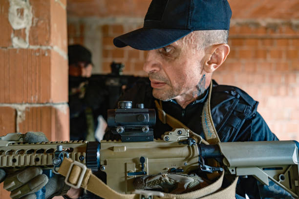 istock Two armed soldiers tactical move inside brick building in military training 2170585777